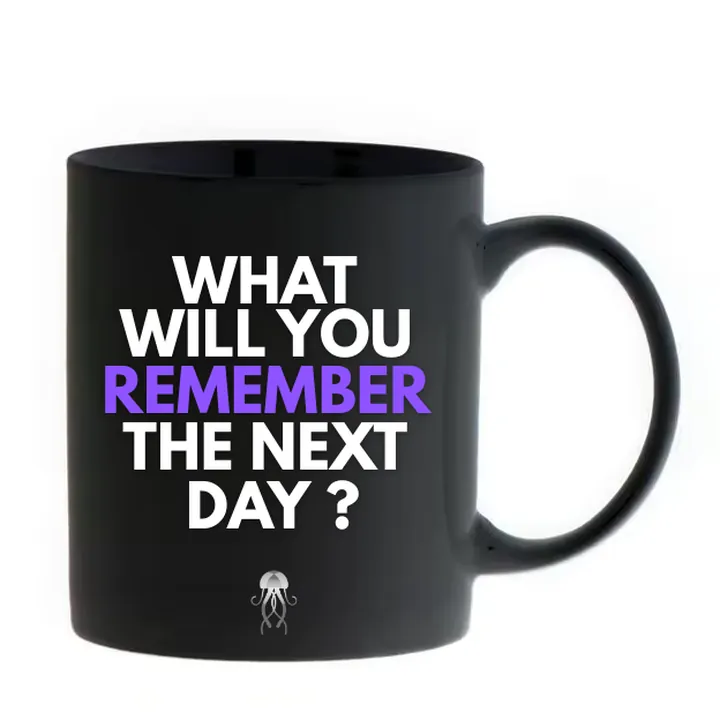 A black ceramic mug printed with the words: What will you remember the next day?