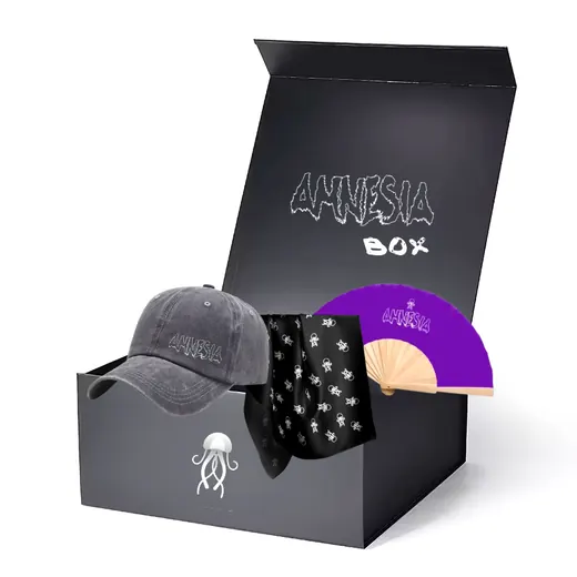 An open black gift box holding a cap, a scarf and a purple fan.