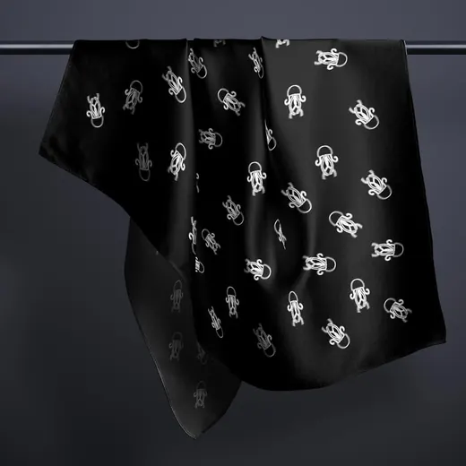 A black scarf with a white jellyfish pattern.